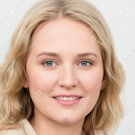 Joyful white young-adult female with long  brown hair and blue eyes