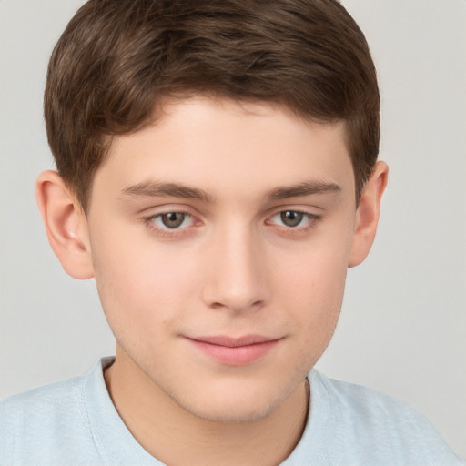 Joyful white child male with short  brown hair and brown eyes