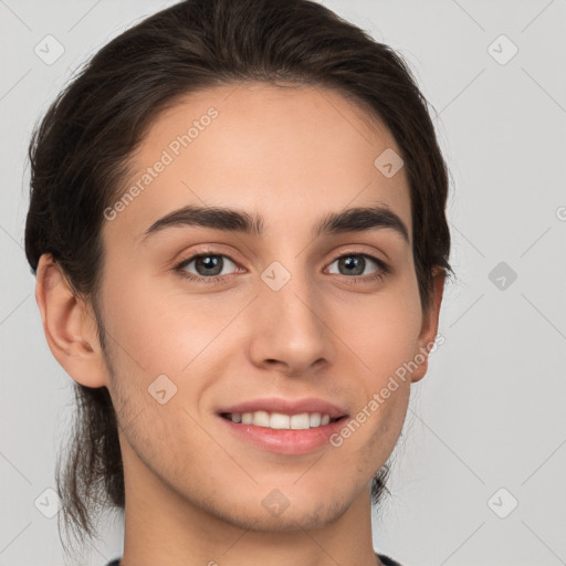 Joyful white young-adult male with medium  brown hair and brown eyes