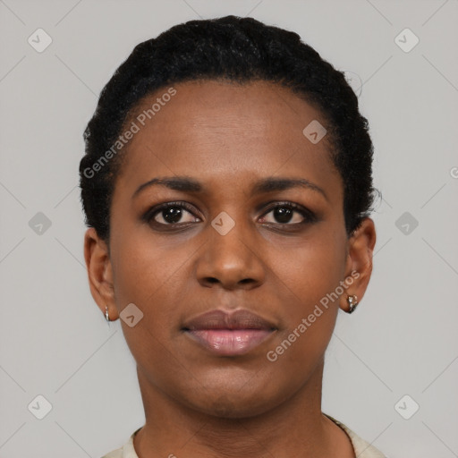 Joyful black young-adult female with short  black hair and brown eyes