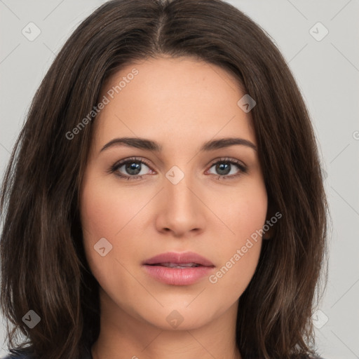 Neutral white young-adult female with long  brown hair and brown eyes