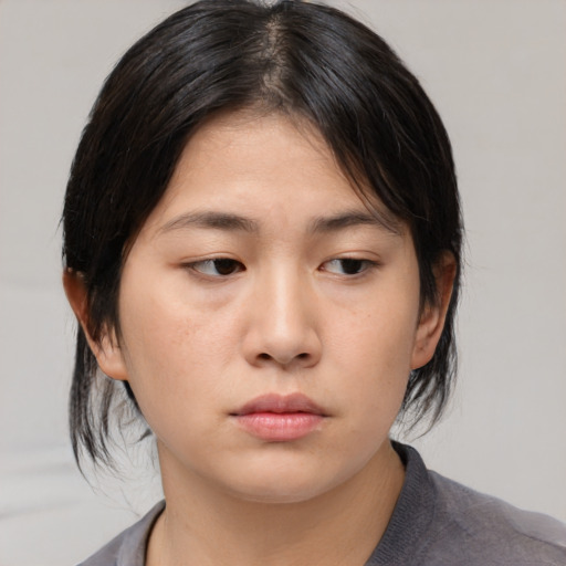 Neutral asian young-adult female with medium  black hair and brown eyes
