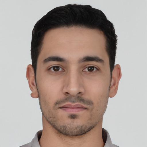 Neutral latino young-adult male with short  black hair and brown eyes