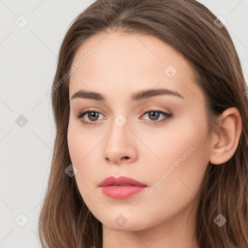 Neutral white young-adult female with long  brown hair and brown eyes