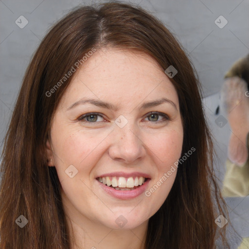 Joyful white young-adult female with long  brown hair and grey eyes