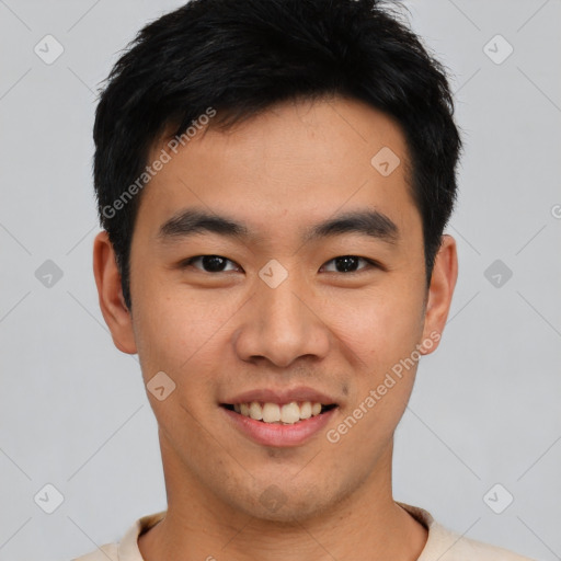 Joyful asian young-adult male with short  black hair and brown eyes