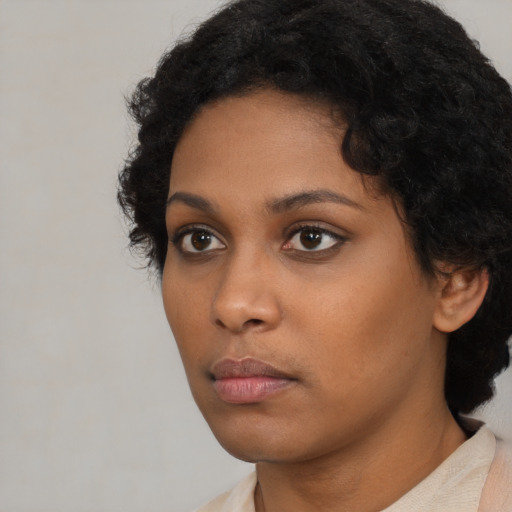 Neutral black young-adult female with short  black hair and brown eyes