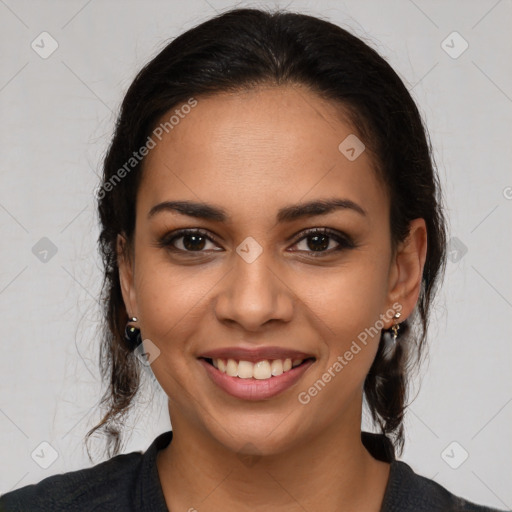 Joyful latino young-adult female with long  brown hair and brown eyes