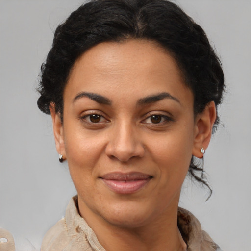 Joyful latino young-adult female with short  brown hair and brown eyes