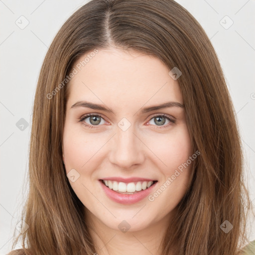 Joyful white young-adult female with long  brown hair and green eyes