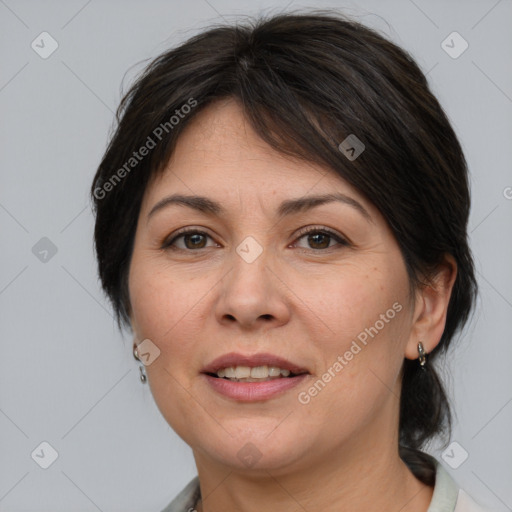 Joyful white adult female with medium  brown hair and brown eyes