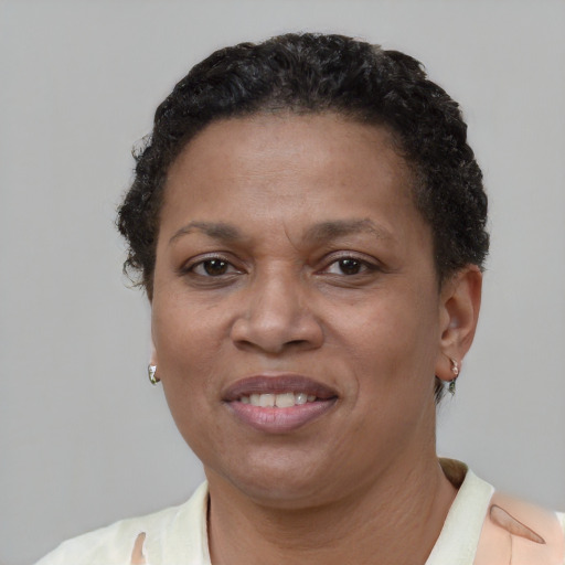 Joyful latino adult female with short  brown hair and brown eyes
