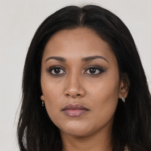 Neutral latino young-adult female with long  black hair and brown eyes