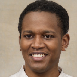 Joyful latino young-adult male with short  brown hair and brown eyes