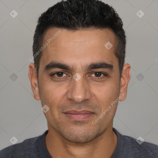 Joyful white young-adult male with short  black hair and brown eyes