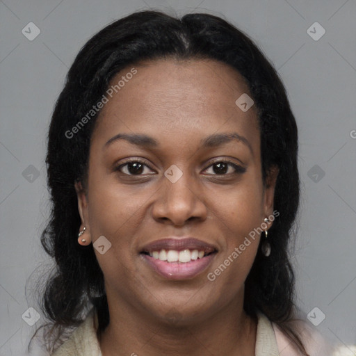 Joyful black young-adult female with long  brown hair and brown eyes