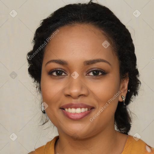 Joyful black young-adult female with long  brown hair and brown eyes