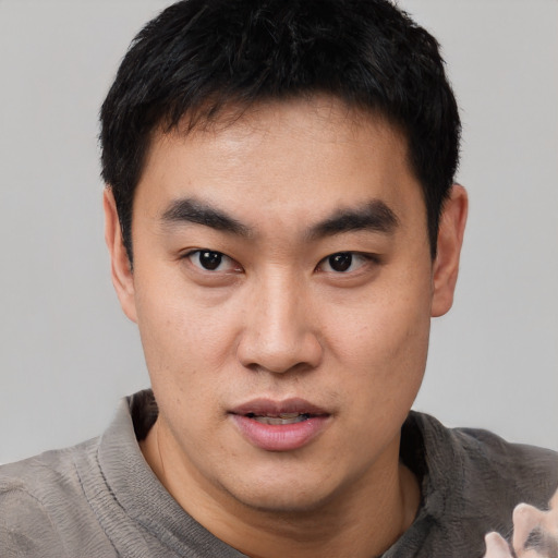 Neutral asian young-adult male with short  black hair and brown eyes