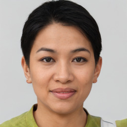 Joyful asian young-adult female with short  brown hair and brown eyes