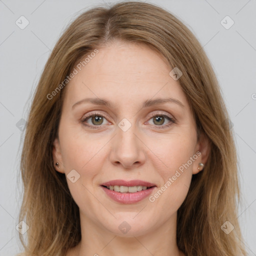 Joyful white adult female with medium  brown hair and grey eyes