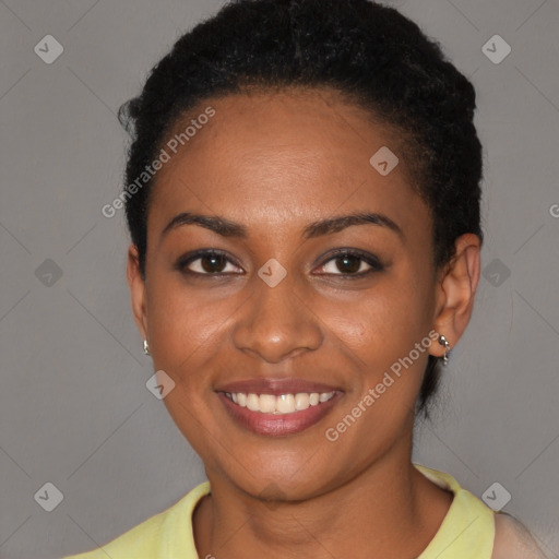 Joyful black young-adult female with short  brown hair and brown eyes