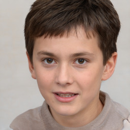 Joyful white child male with short  brown hair and brown eyes