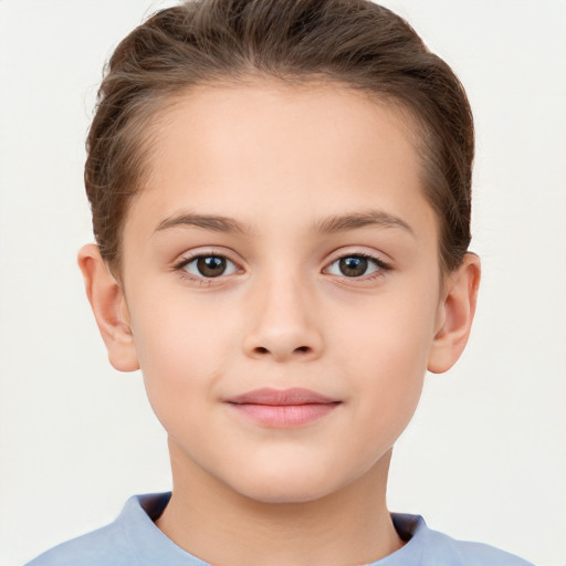 Joyful white child female with short  brown hair and brown eyes