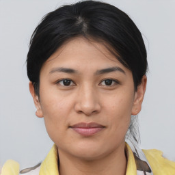 Joyful asian young-adult female with short  brown hair and brown eyes