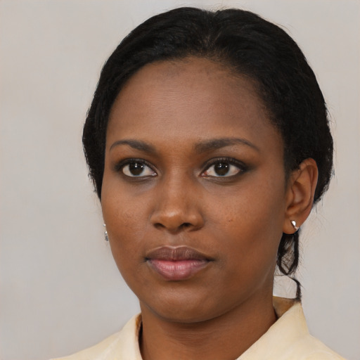 Neutral black young-adult female with medium  black hair and brown eyes
