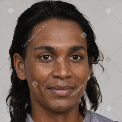 Joyful black adult female with medium  black hair and brown eyes