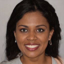 Joyful black young-adult female with medium  brown hair and brown eyes