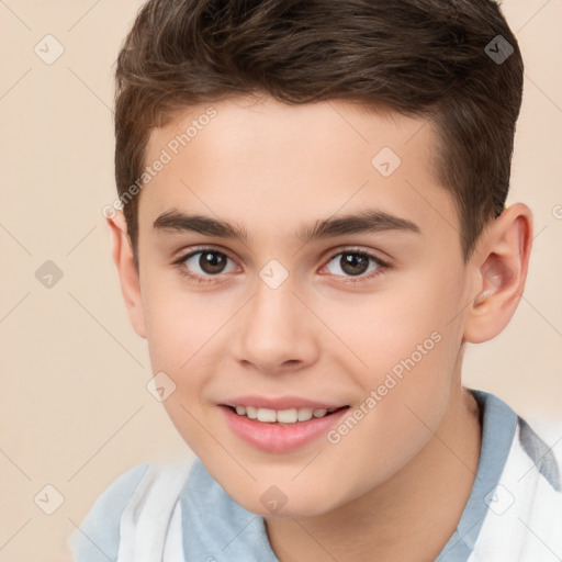 Joyful white child male with short  brown hair and brown eyes