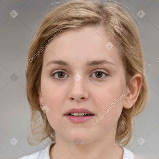 Joyful white young-adult female with medium  brown hair and blue eyes