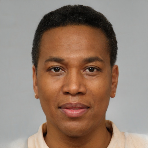 Joyful black young-adult male with short  brown hair and brown eyes