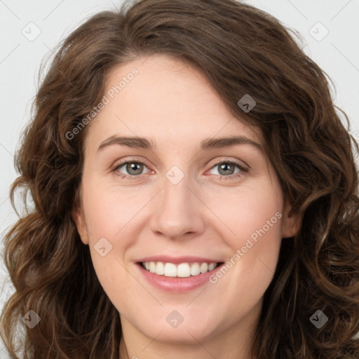 Joyful white young-adult female with long  brown hair and green eyes