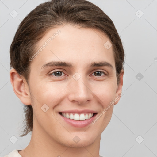 Joyful white young-adult female with short  brown hair and grey eyes