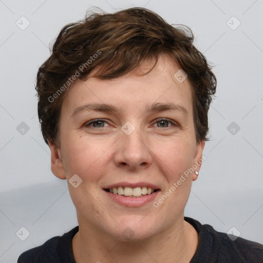 Joyful white adult female with short  brown hair and grey eyes