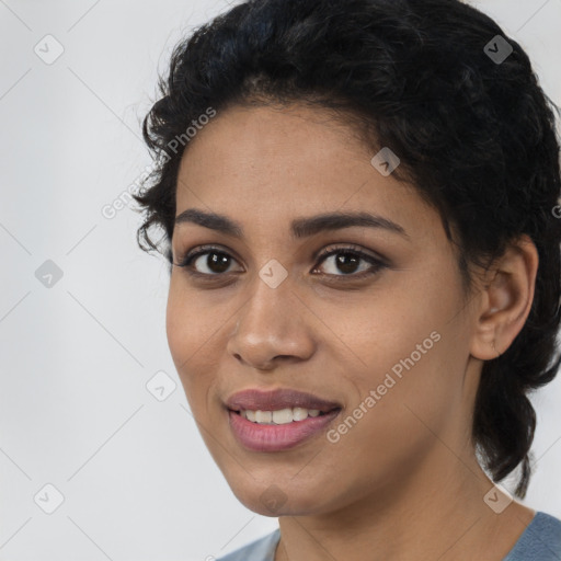 Joyful latino young-adult female with short  black hair and brown eyes