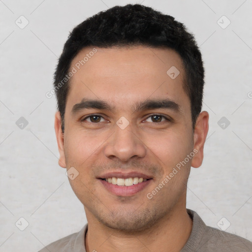 Joyful white young-adult male with short  black hair and brown eyes