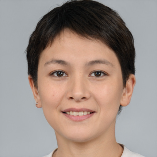 Joyful white young-adult female with short  brown hair and brown eyes
