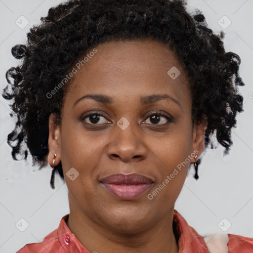 Joyful black adult female with short  brown hair and brown eyes