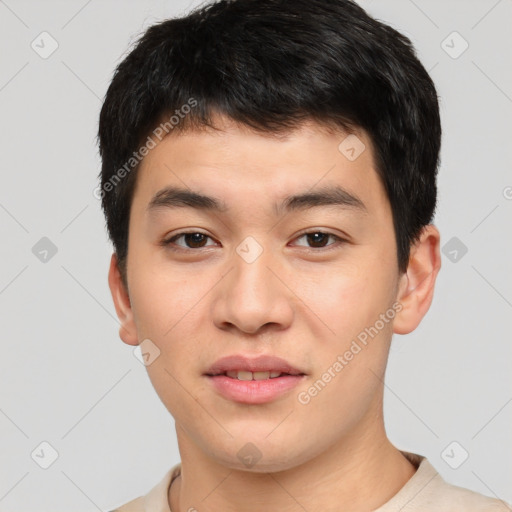 Joyful asian young-adult male with short  brown hair and brown eyes