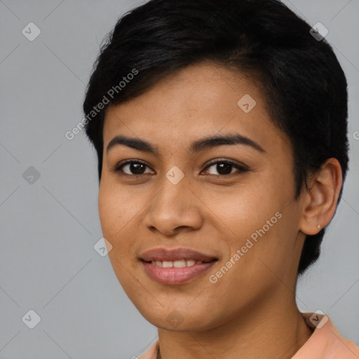 Joyful asian young-adult female with short  black hair and brown eyes