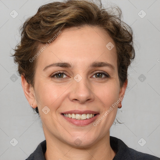 Joyful white adult female with medium  brown hair and grey eyes