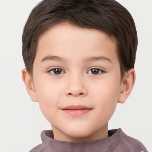 Joyful white child male with short  brown hair and brown eyes