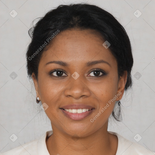 Joyful black young-adult female with short  black hair and brown eyes