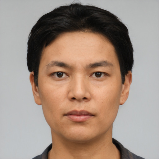 Neutral asian adult male with short  black hair and brown eyes