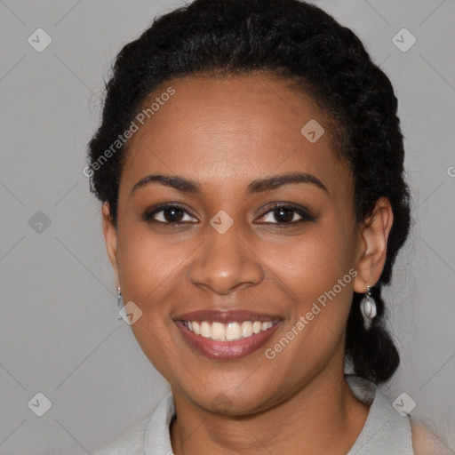 Joyful black young-adult female with medium  black hair and brown eyes