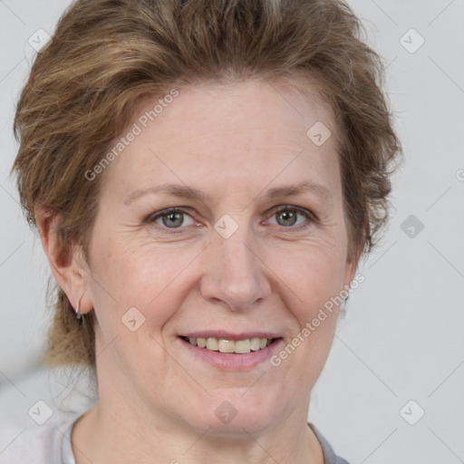 Joyful white adult female with short  brown hair and grey eyes