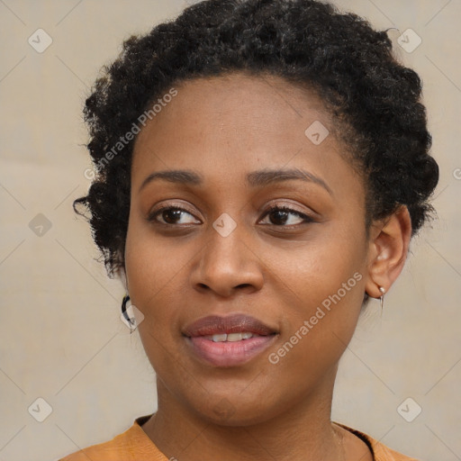 Joyful black young-adult female with medium  brown hair and brown eyes